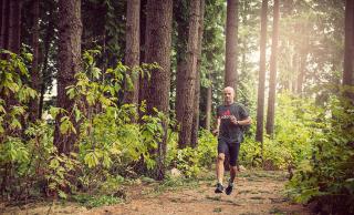 Photo of Malcolm Smillie running in Pacific Spirit Forest 