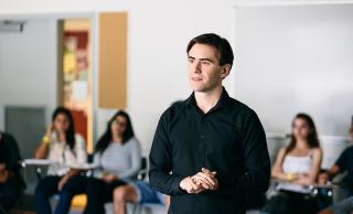 Photo of Michael Griffin in the classroom with students