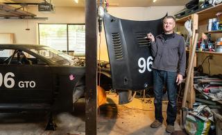 Andre Marziali posing with car hood