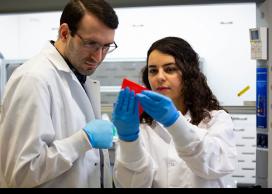 UBC Okanagan researchers Sadaf Shabanian (left) and Kevin Golovin (right) test water-repellent fabric treatment